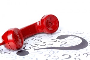 Red Phone with Questions and Numbers